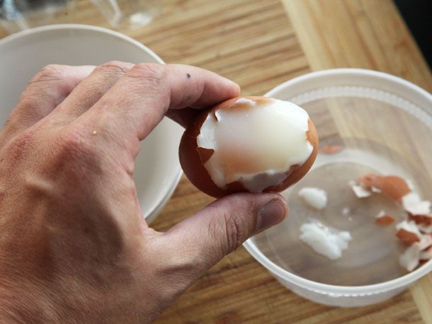 Sous vide poached egg cracked open over bowl