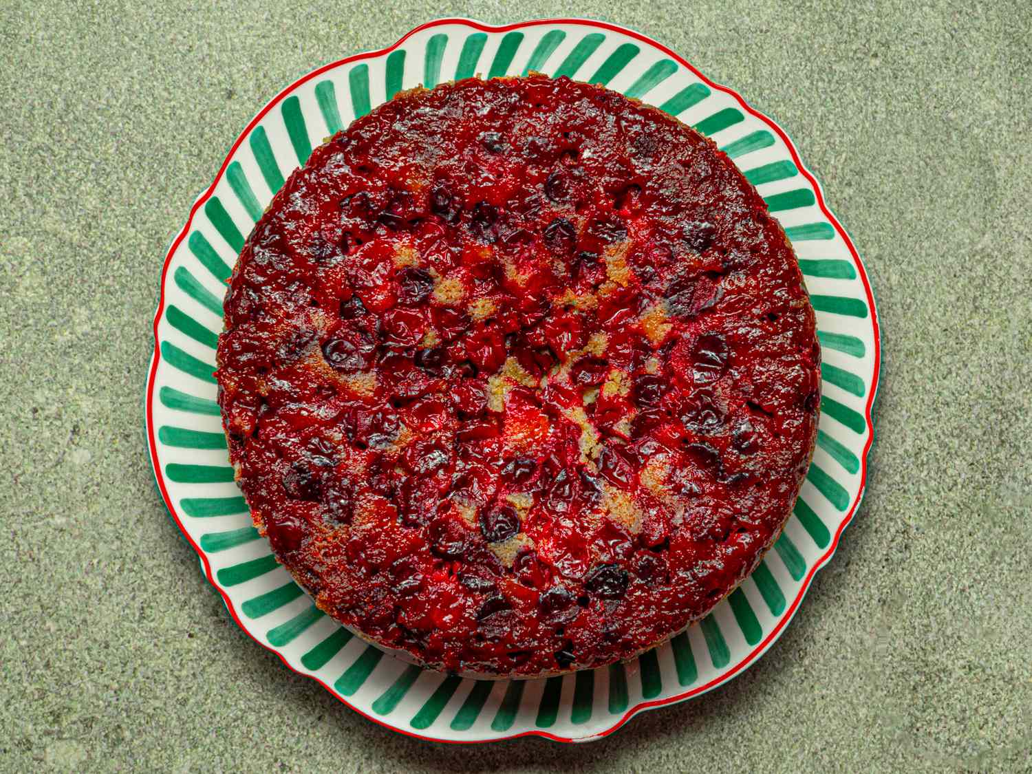 Cranberry upsidedown cake on a decorative plate