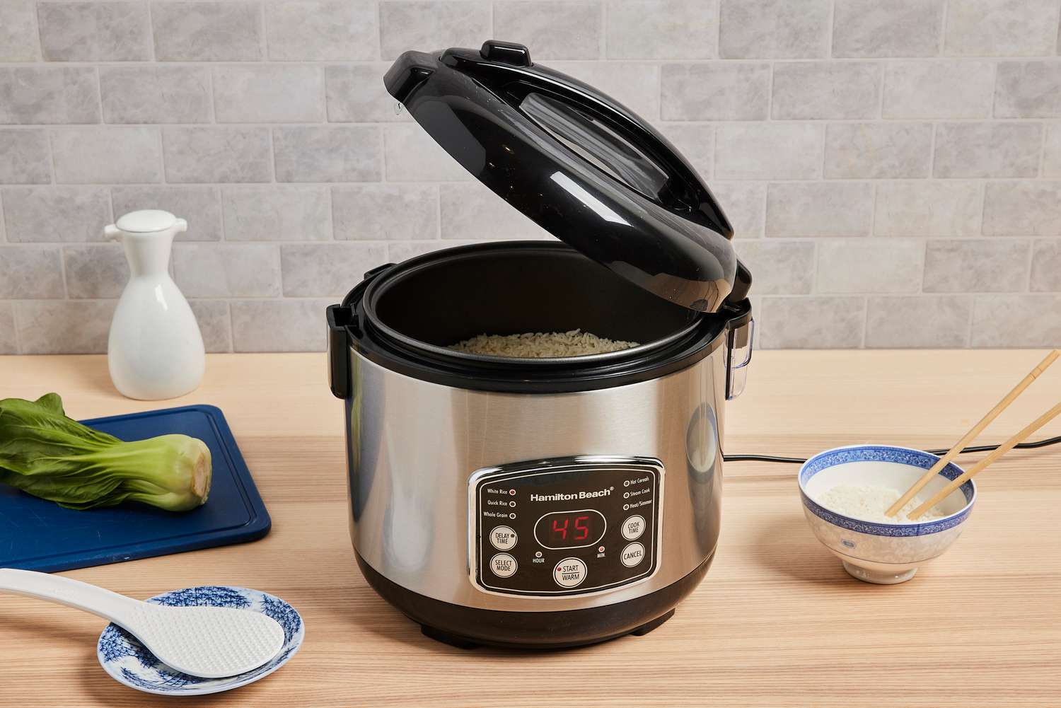 a rice cooker with the lid ajar