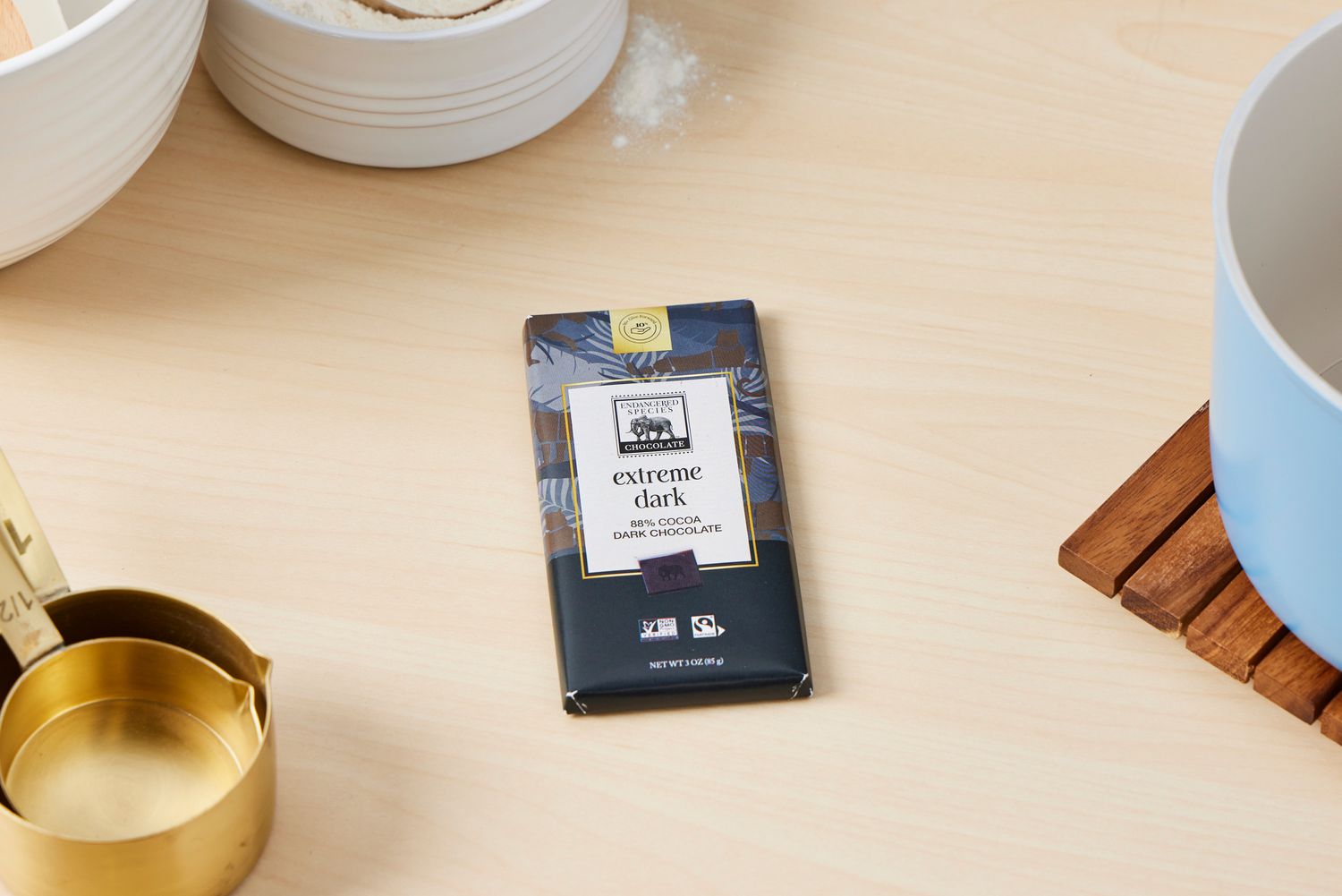 An Endangered Species extreme dark chocolate bar on a kitchen countertop.