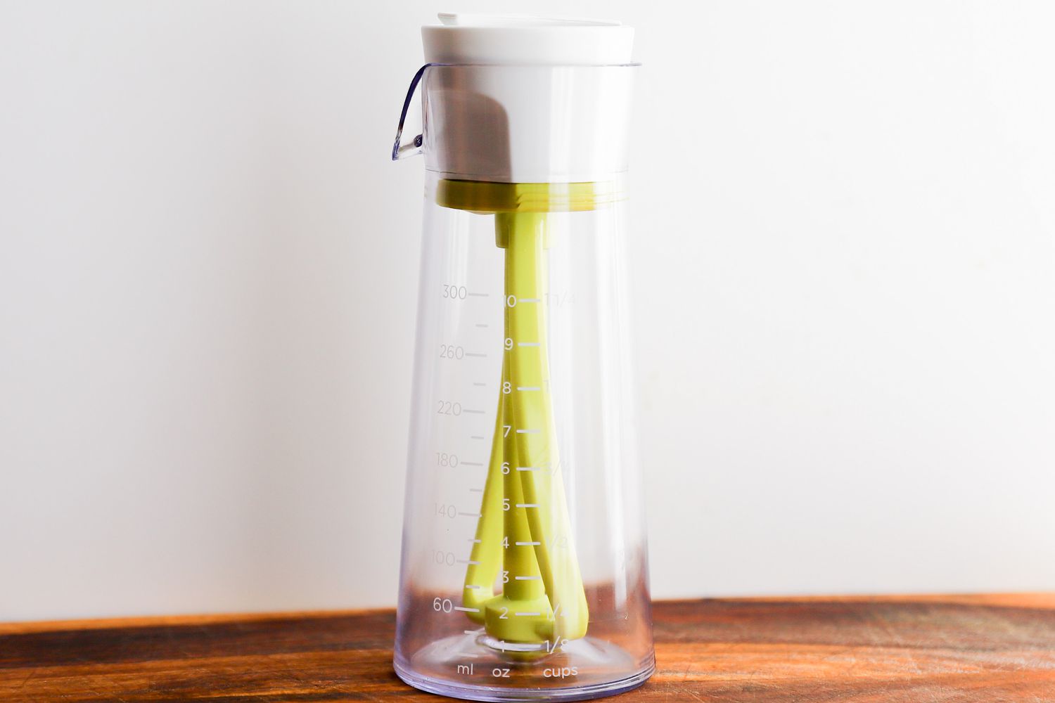 Emulstir Salad Dressing Mixer on a wooden counter top