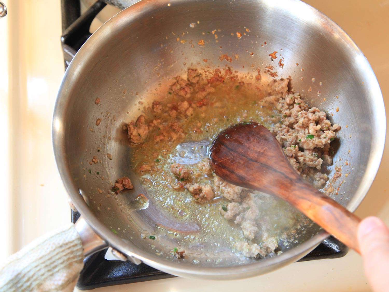 Browning ground meat mixture in skillet.