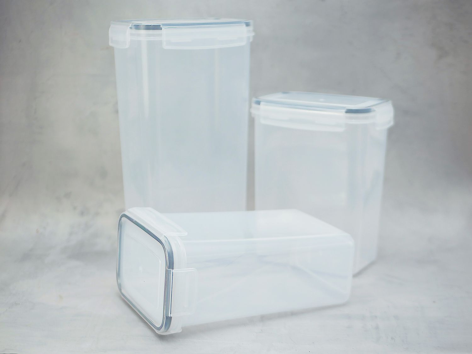 three chef's path containers on a gray surface