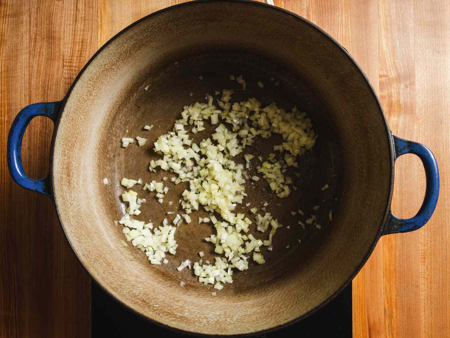 Onions simmering in a pot.