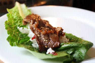 Beef bulgogi on a romaine leaf with some white rice. 