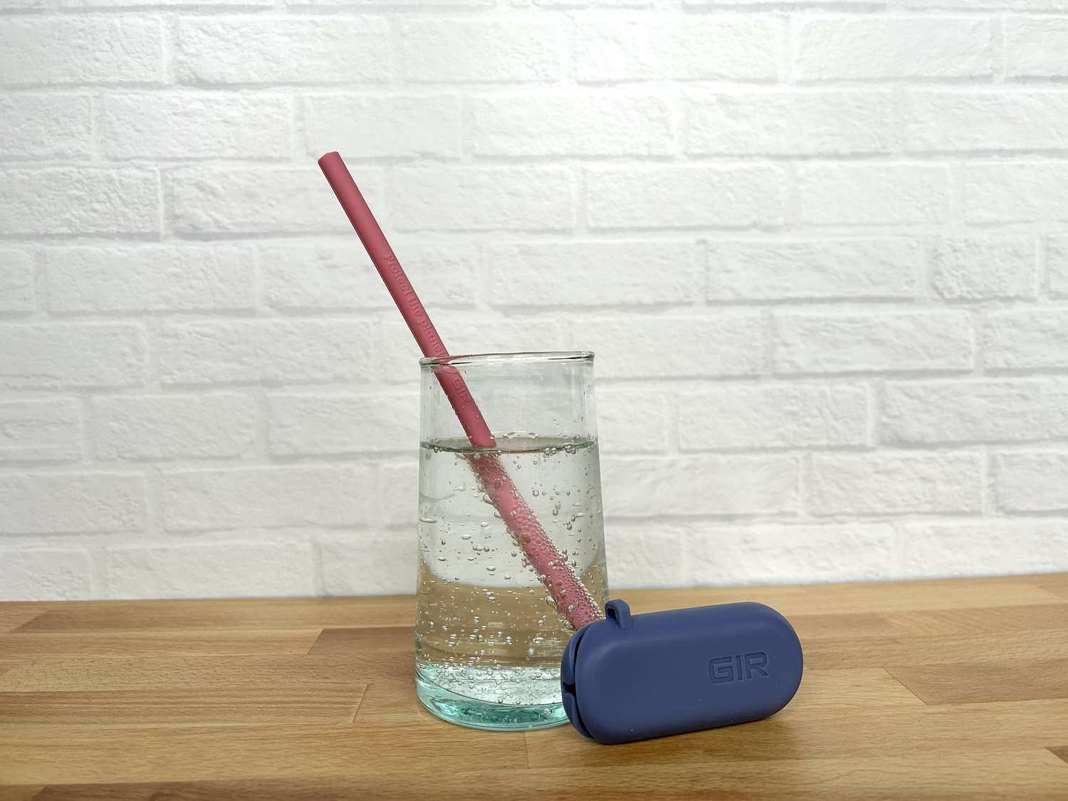 A silicone straw in a glass of sparkling water