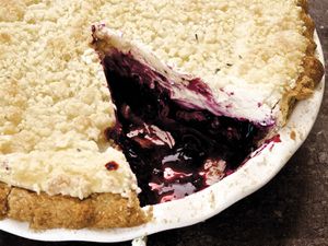 A gluten-free blueberry cheesecake pie with streusel topping