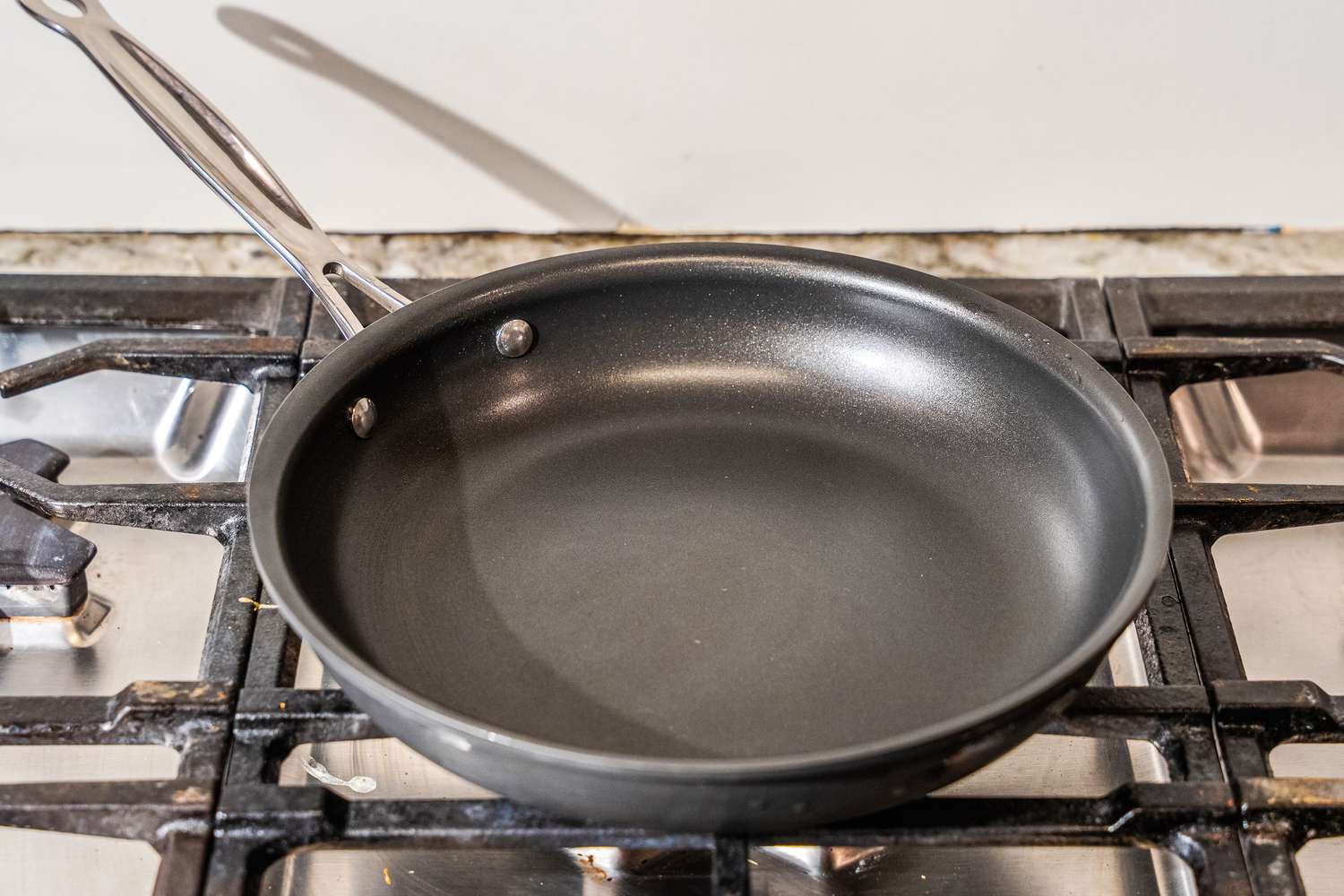The Cuisinart 622-24 Chef’s Classic Nonstick Skillet on a stovetop.
