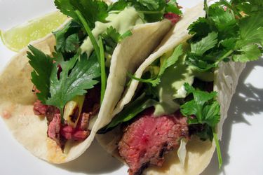 Closeup of a pair of chipotle steak tacos.