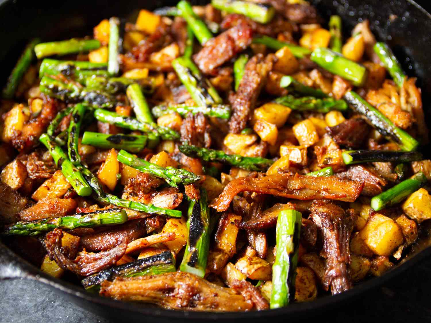 Crispy Pork Shoulder Hash With Asparagus and Serrano
