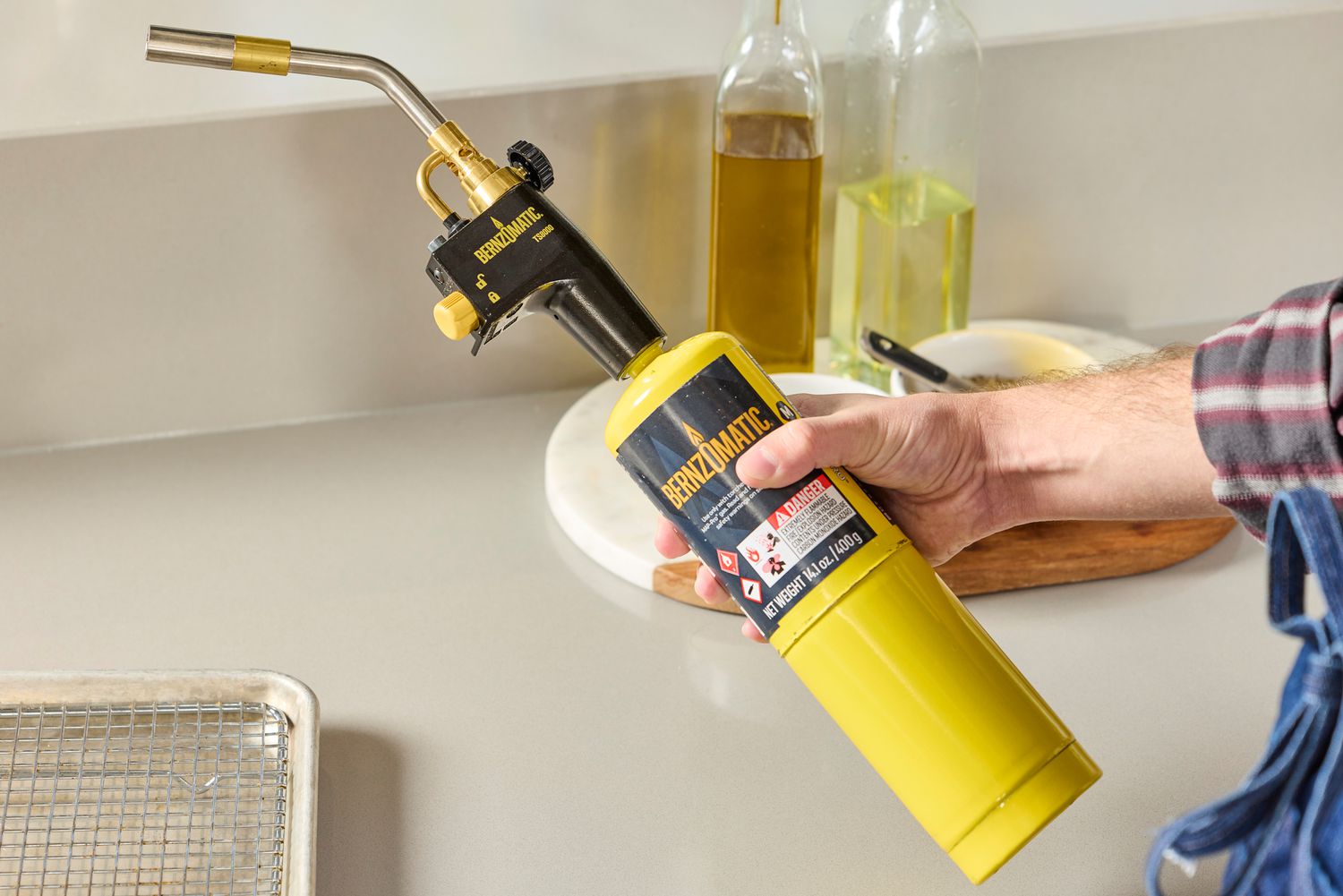 someone holding the bernzomatic 