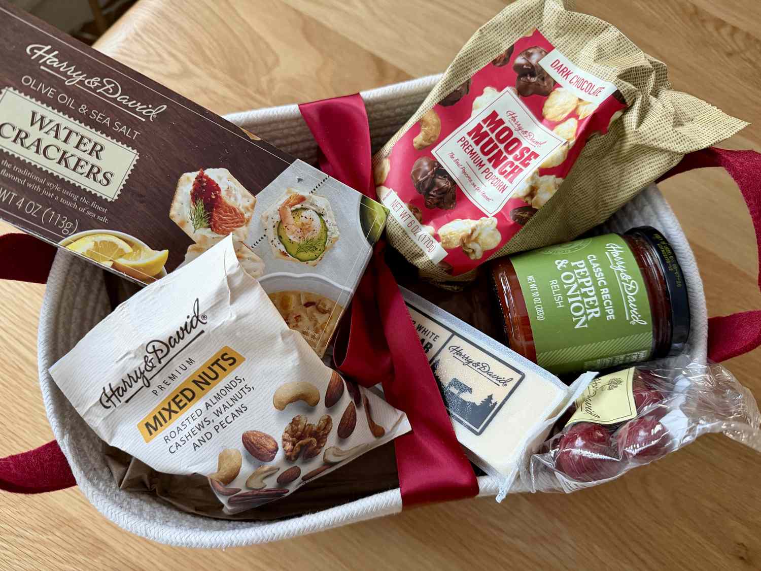 The Harry & David Season's Best Gift Basket filled with packaged goods and food.