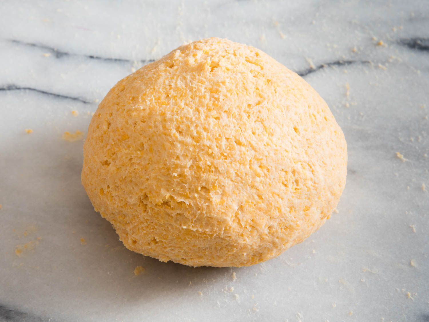 The cheez-it dough, kneaded and gathered into a ball.