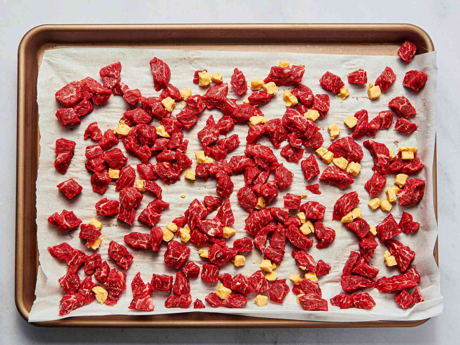 Overhead view of cubed meat and butter