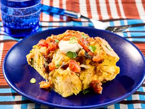 A serving of Southwest breakfast strata on a blue plate