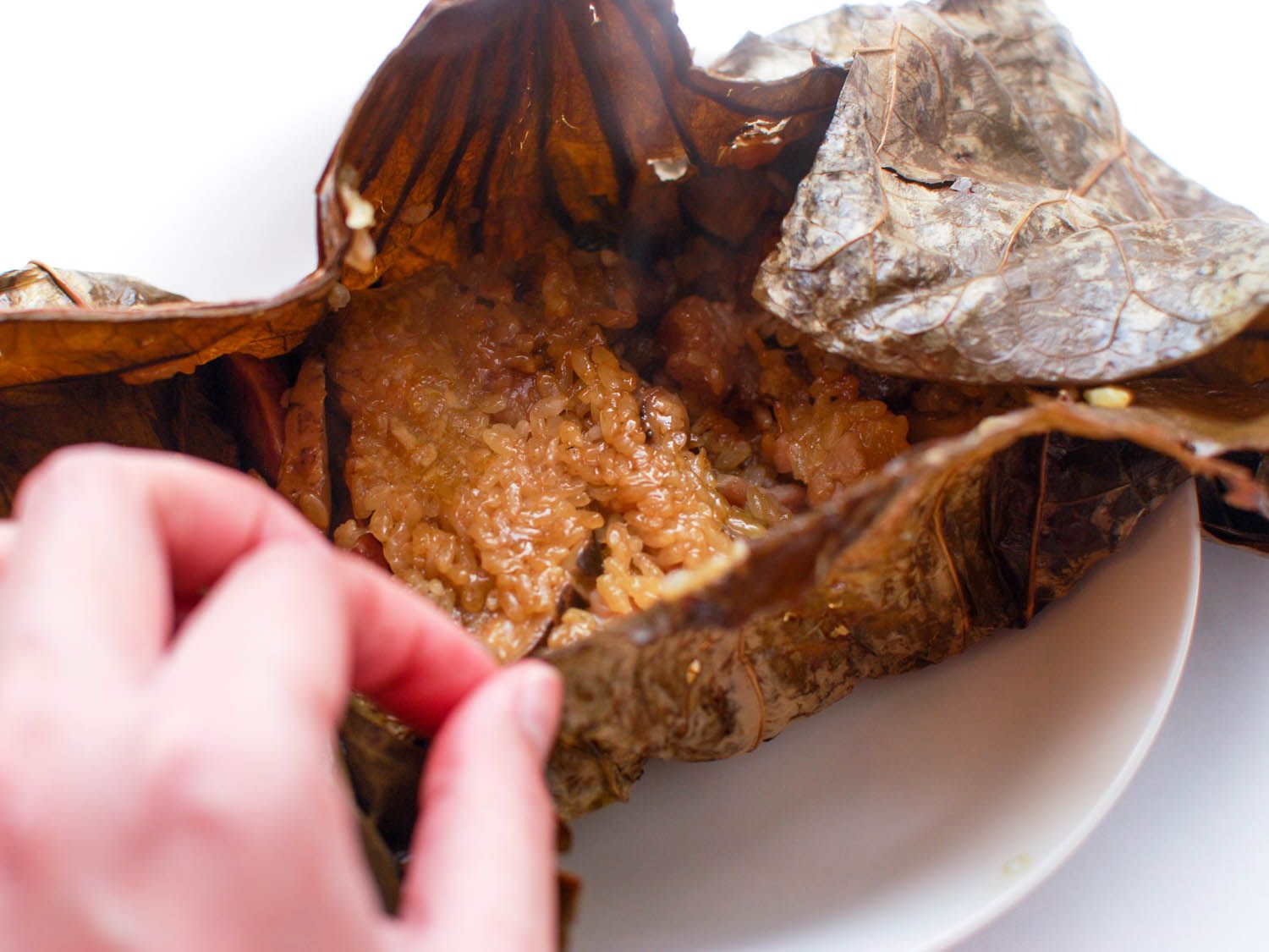 A sticky rice package opened, showing the contents are not fully cooked.