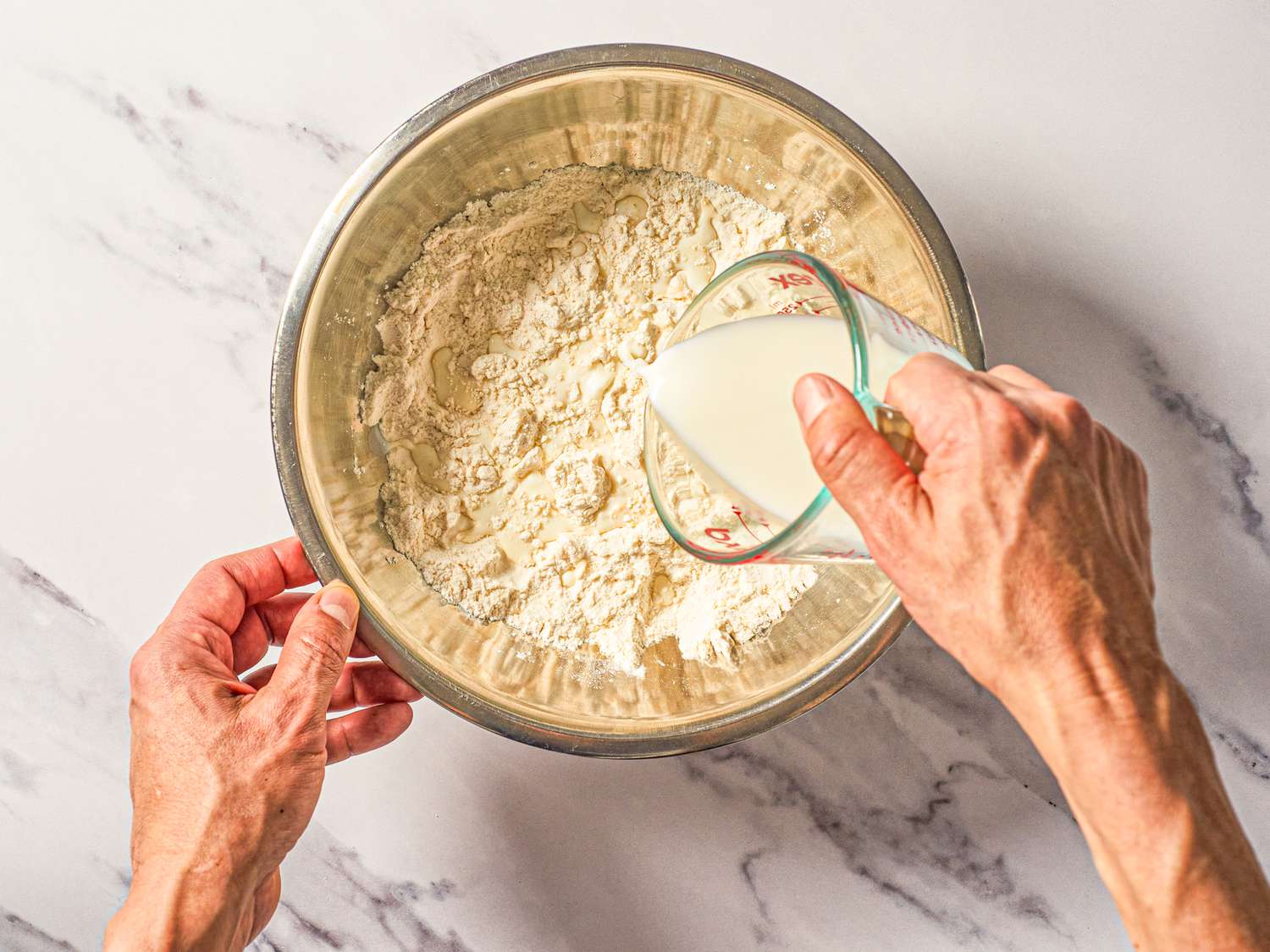 Overhead view of adding milk