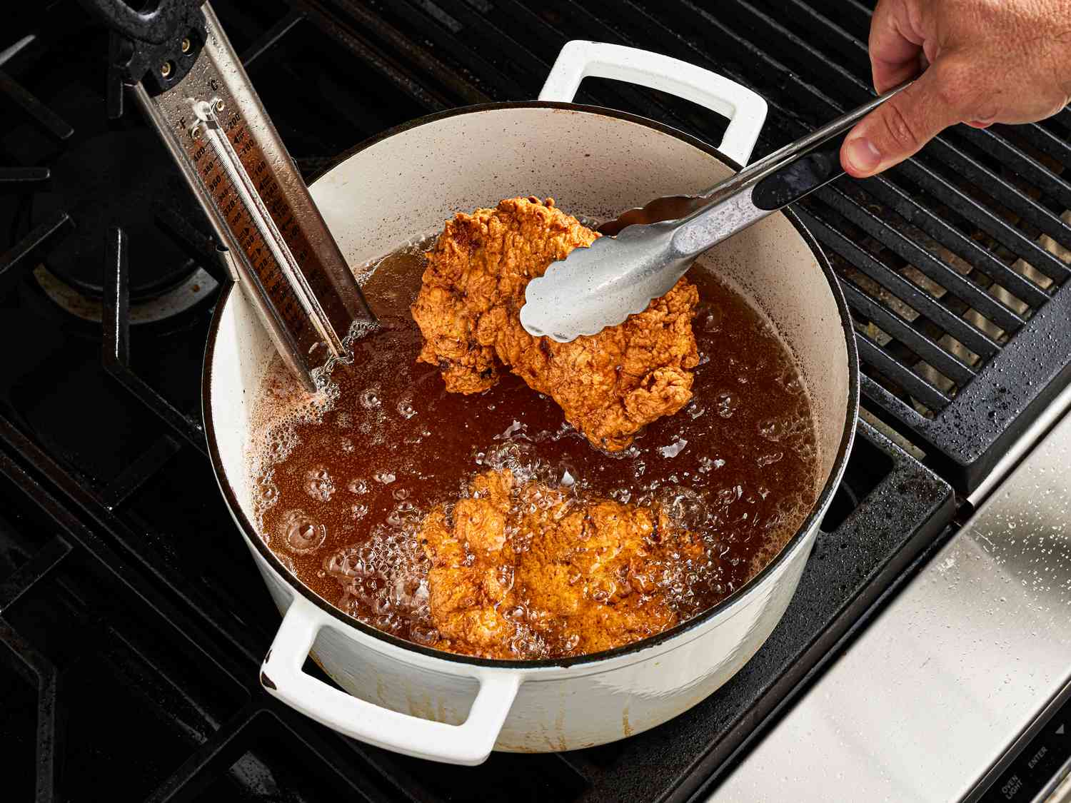 Side view of frying chicken 