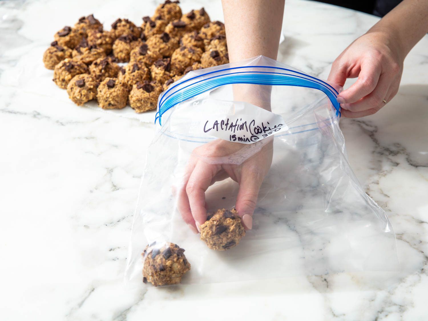 Portioned cookie dough transferred to a large, heavy duty zip-top bag.