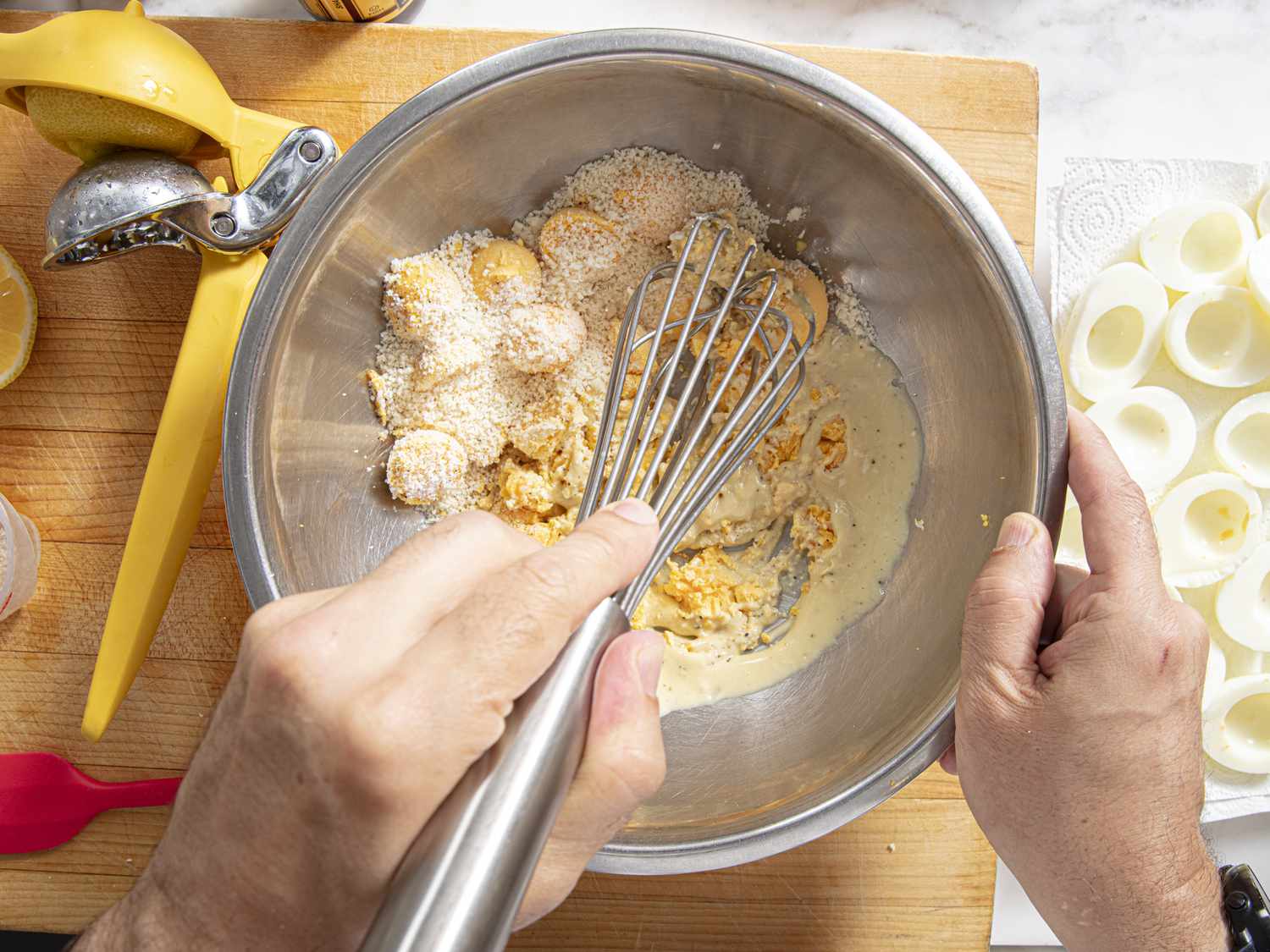 Overhead view on whisking egg mixture