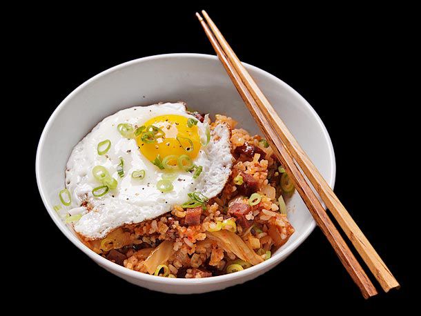 Spam-chi fried rice, served in a bowl with chopsticks.