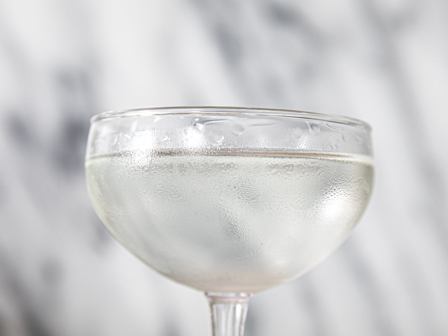 An up close shot of a full coupe glass's bowl