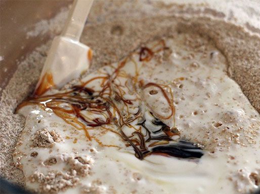 Close-up of the ingredients for DIY grape nuts being mixed together in a bowl.