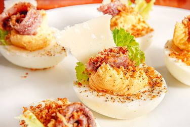 Side view of Caesar-ed deviled eggs