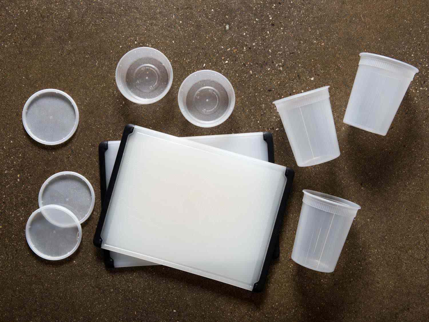 Plastic food storage containers and plastic cutting boards.
