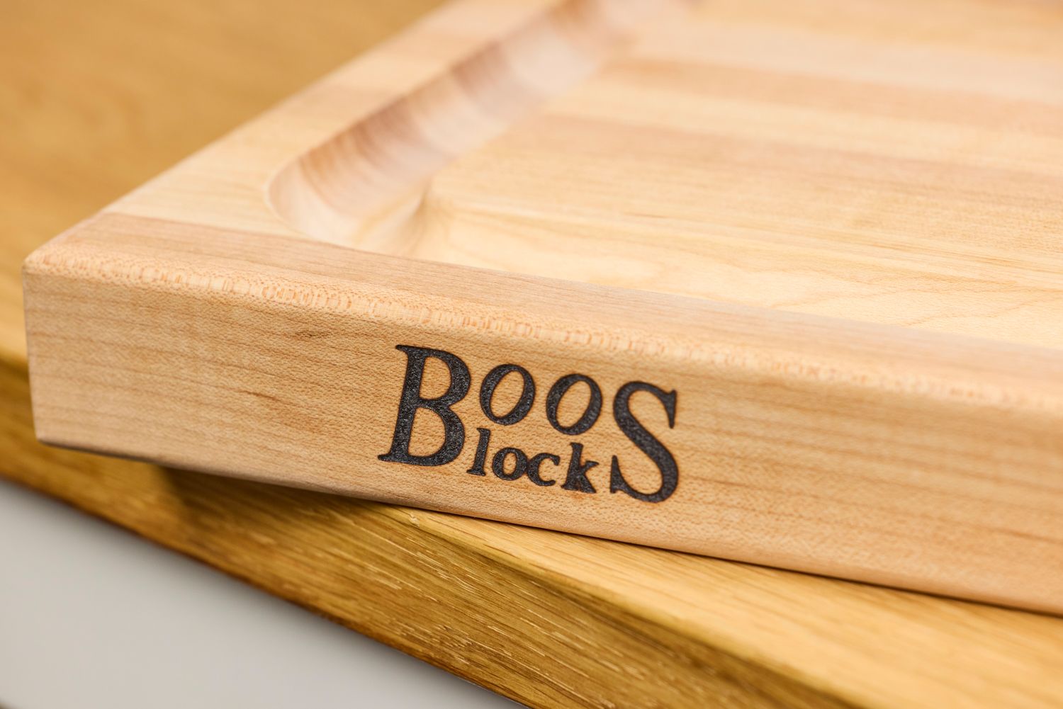 Closeup of a John Boos Reversible Maple Wood Cutting Board with Juice Groove