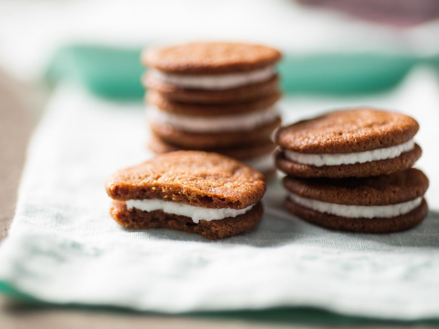 Closeup of crispy lemon-ginger sandwich cookies.