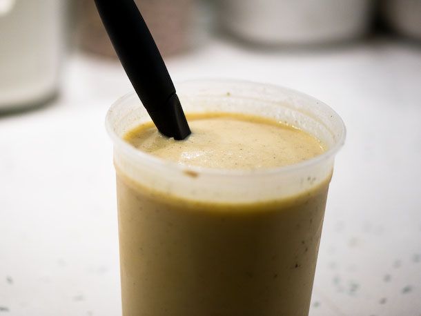 A quart container filled with canele batter.