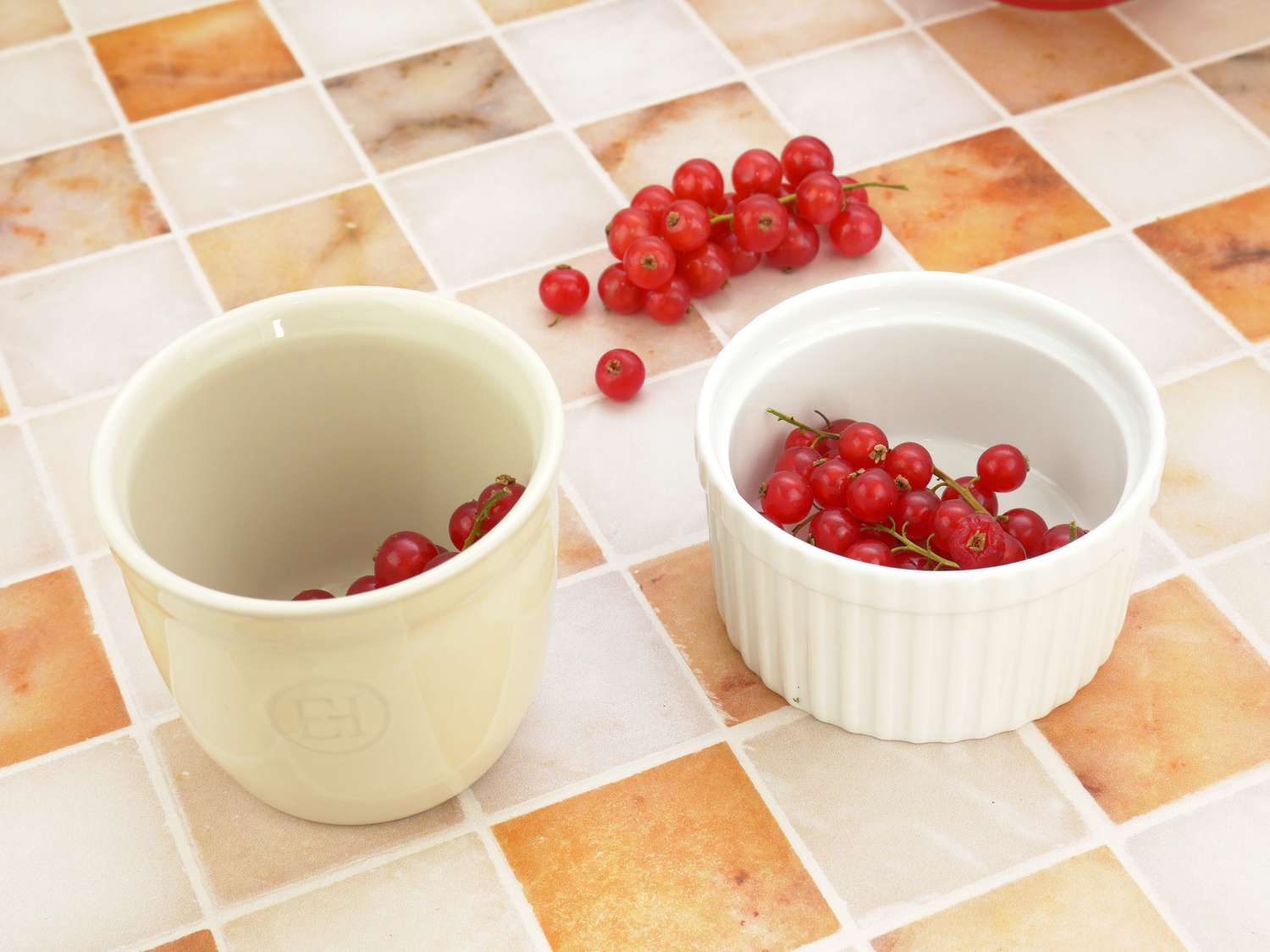 a tall ramekin next to a shorter one