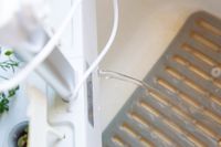 Draining water out of the iDoo indoor herb garden