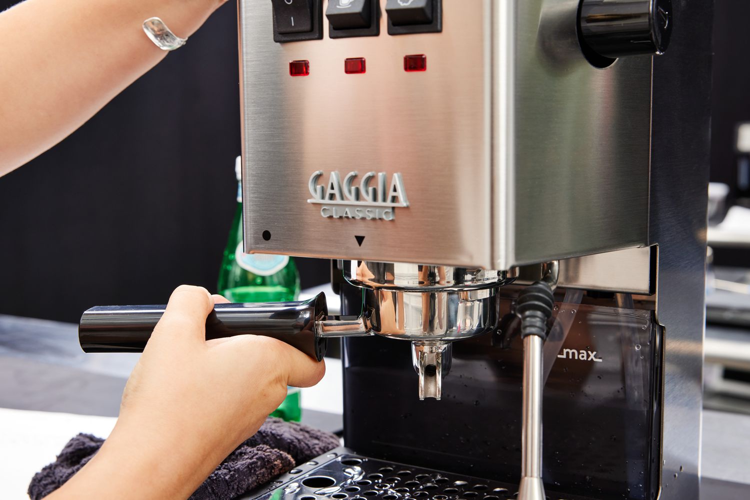 A person adjusting the Gaggia Classic Pro Espresso Machine