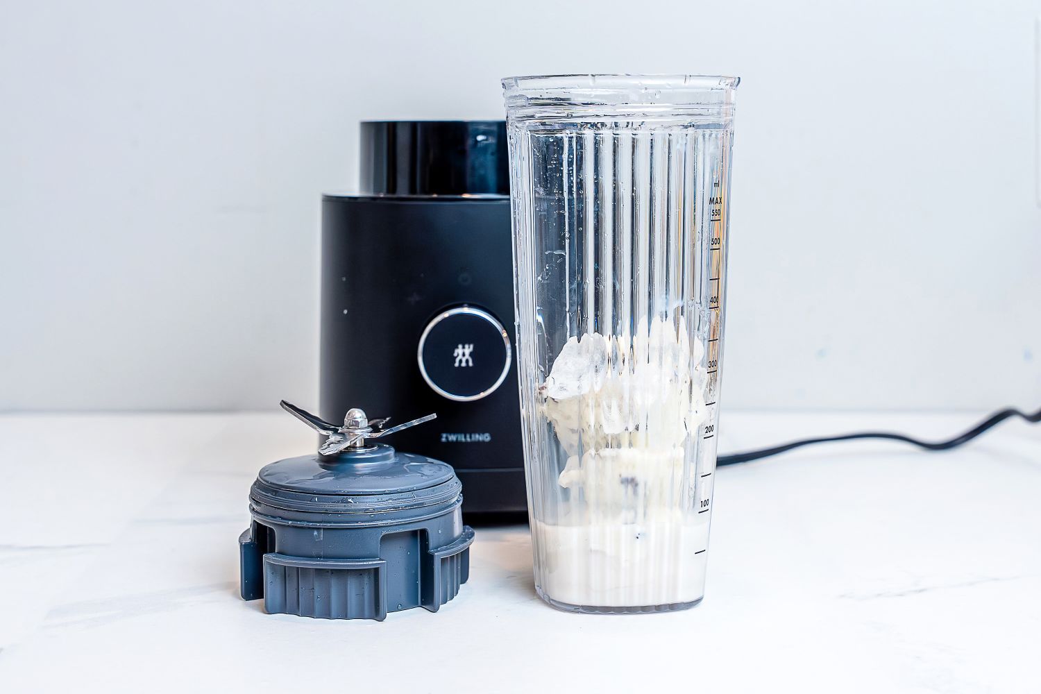 Zwilling Enfinigy Personal Blender on white coutertop