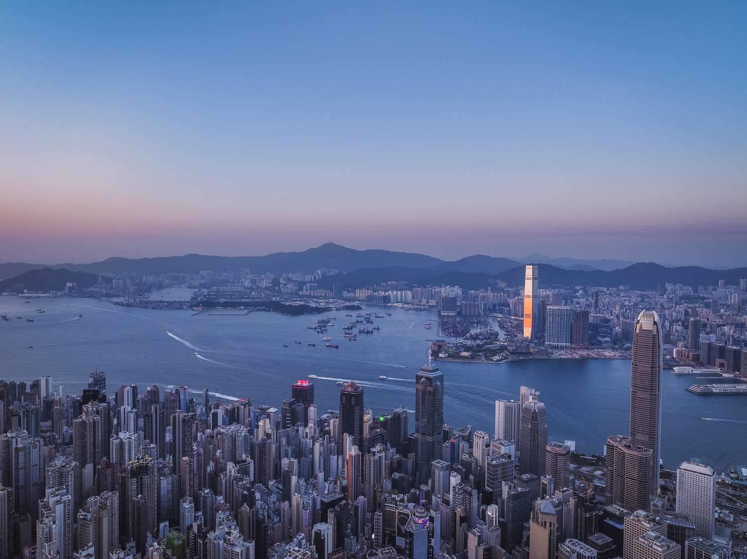 Aerial view of Hong Kong Victoria harbour in sunset -