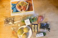 Marley Spoon meal ingredients arranged on a wood surface