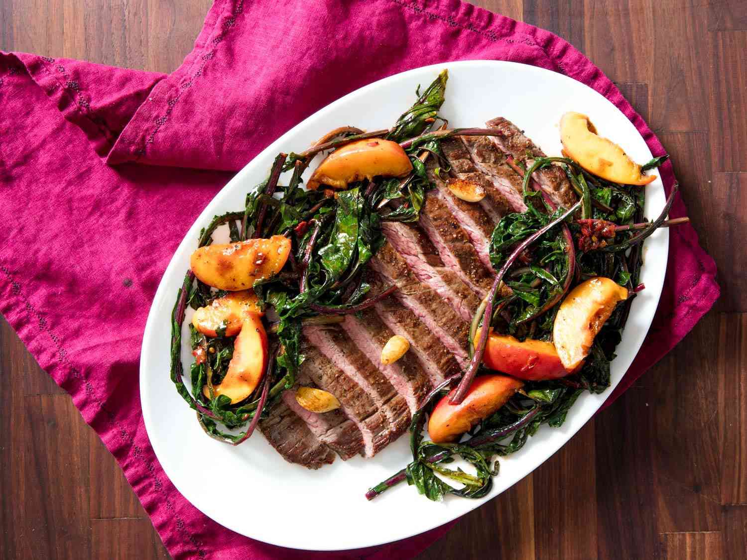 pan-seared flank steak with dandelion and peach