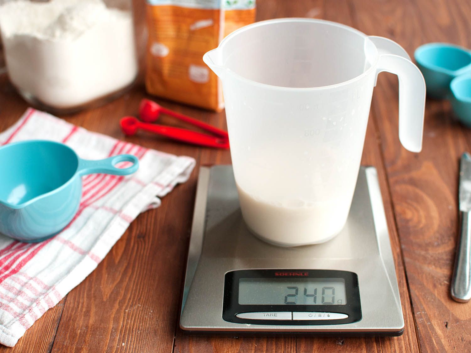 A measuring cup on a scale.