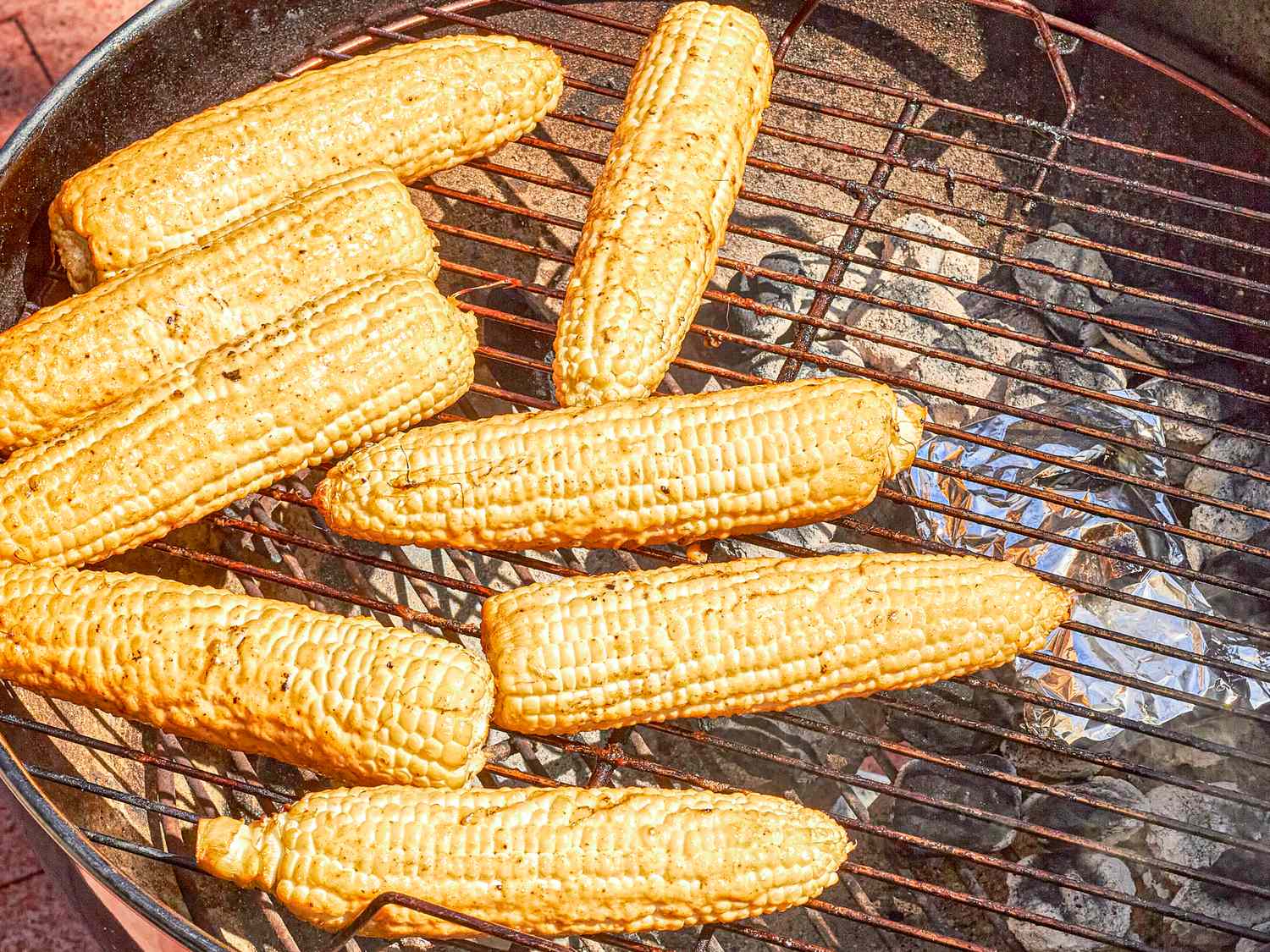 Grilled corn on the cob on a barbecue grill