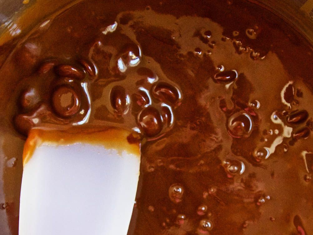 Chocolate caramel sauce bubbling in a pan.