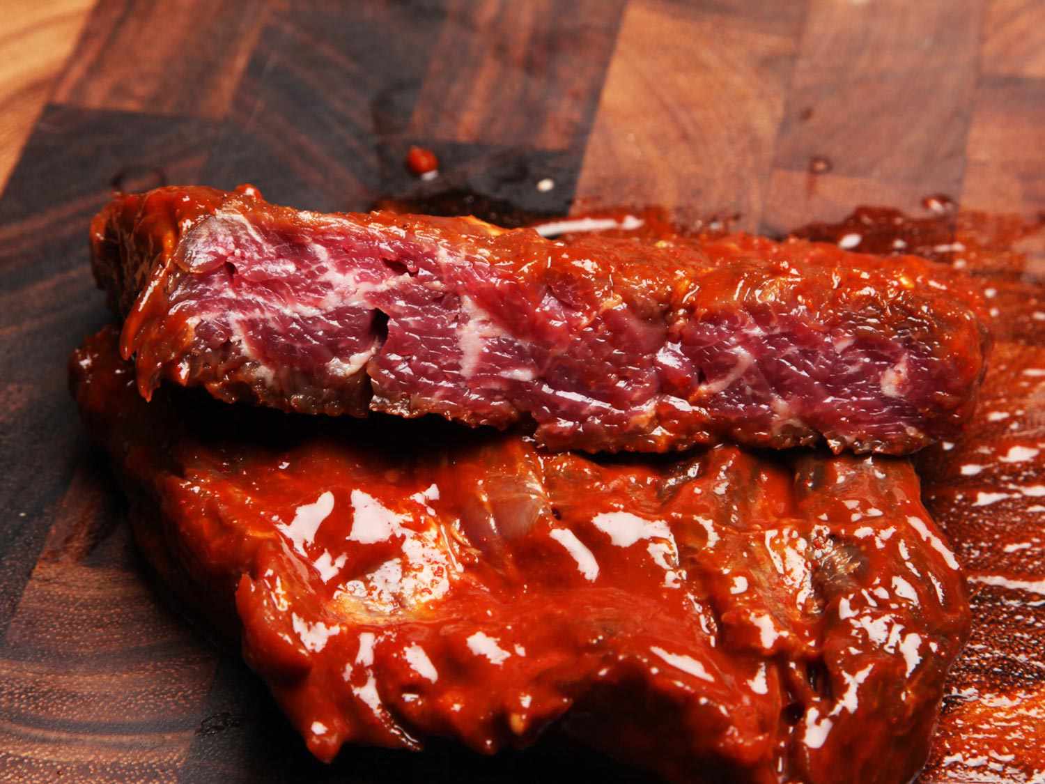 A marinated steak cut in half to reveal the small depth to which the marinade had penetrated.