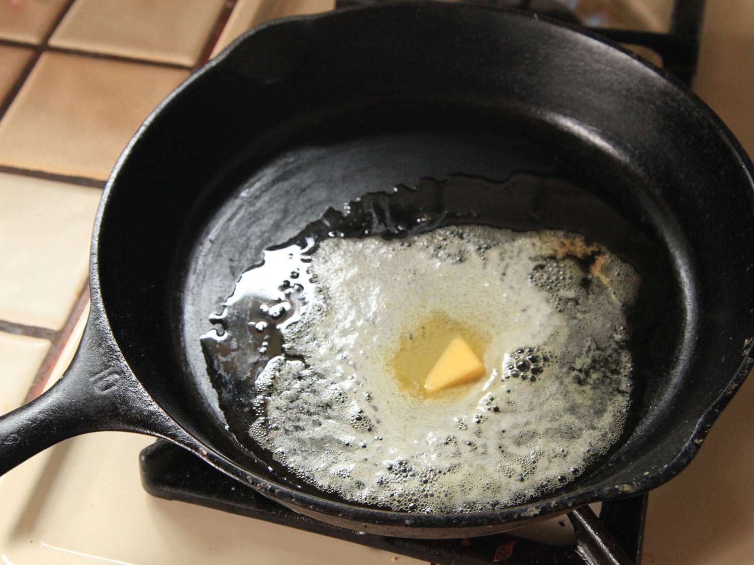 Melting butter in a cast iron skillet on the stovetop