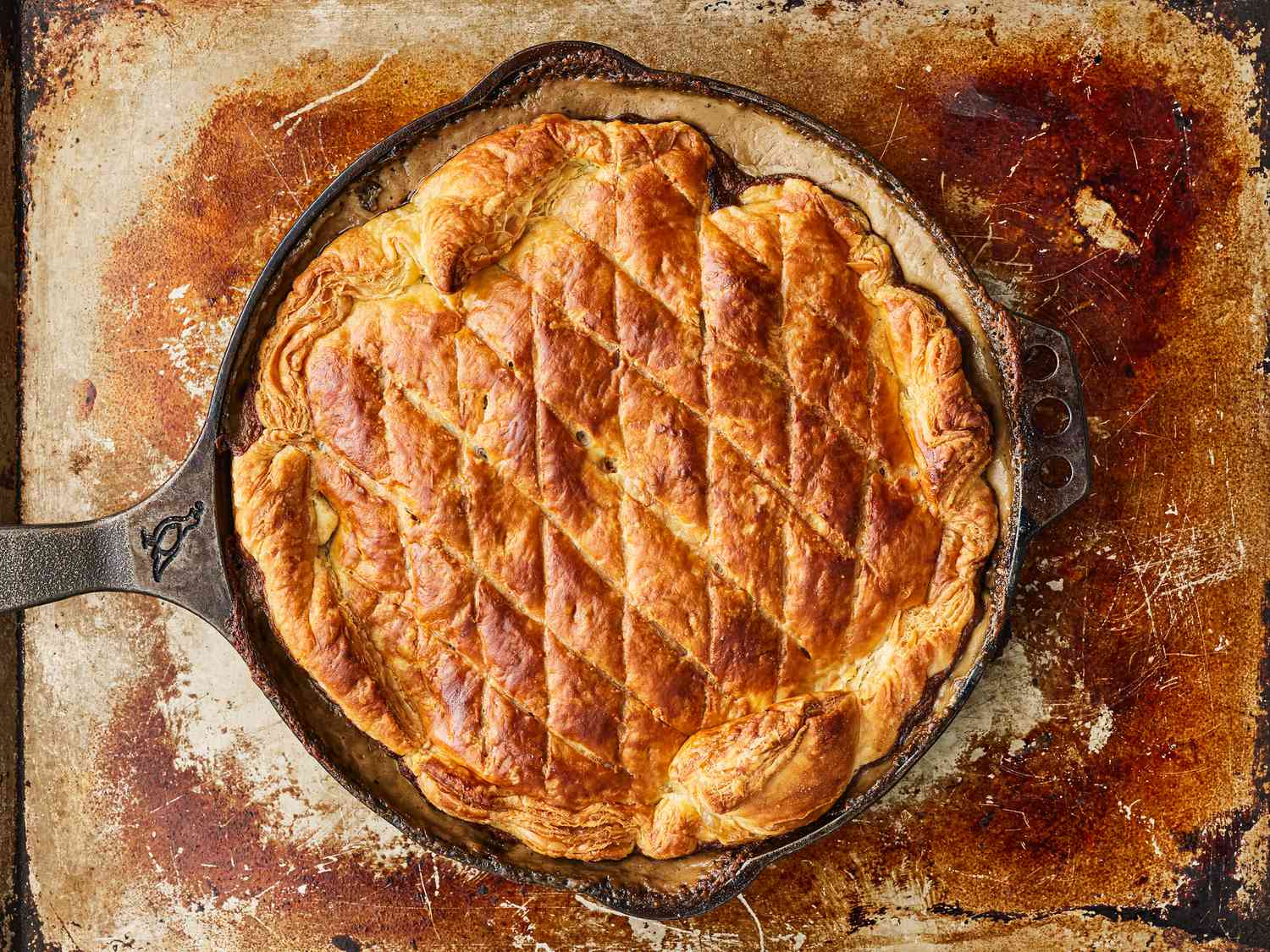 Baked pot pie in skillet, cooked to golden brown and bubbly