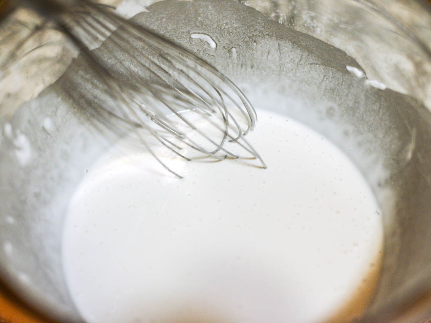 Whisking the rice cake batter.