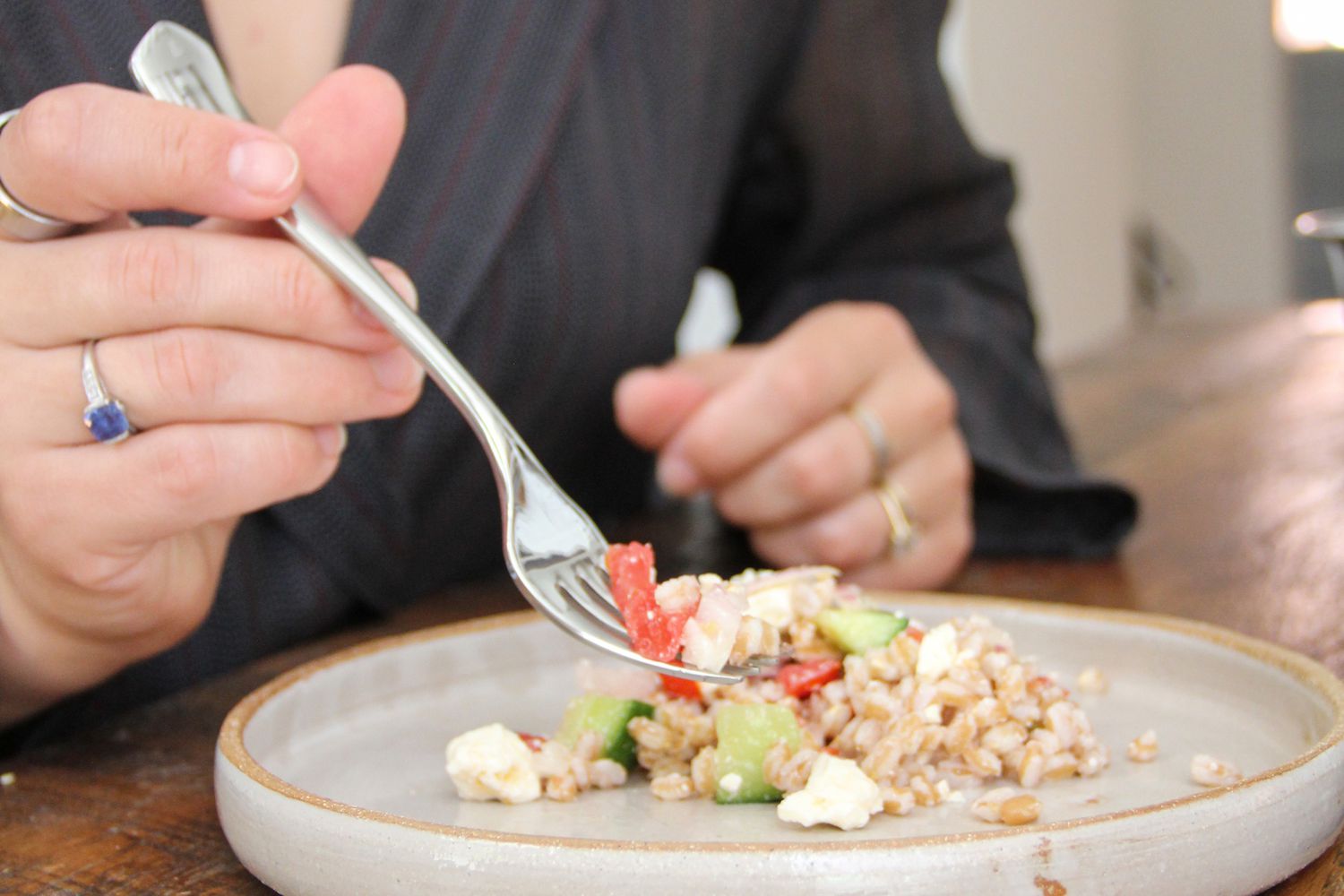 A person using a fork from Robert Welch Westbury Flatware Set
