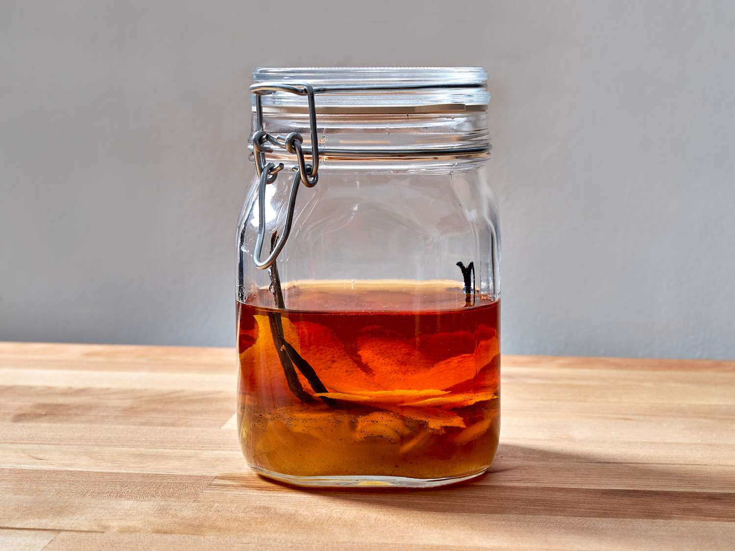 Orange zest, ginger/vanilla syrup, and brandy in a jar, steeping.