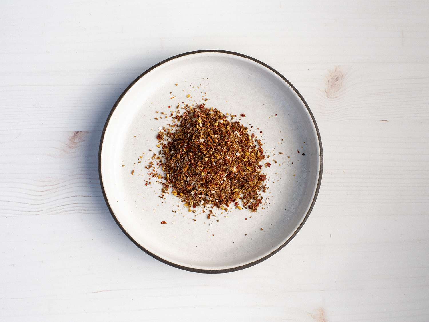 Prepared spice mixture for lamb toothpicks on a plate