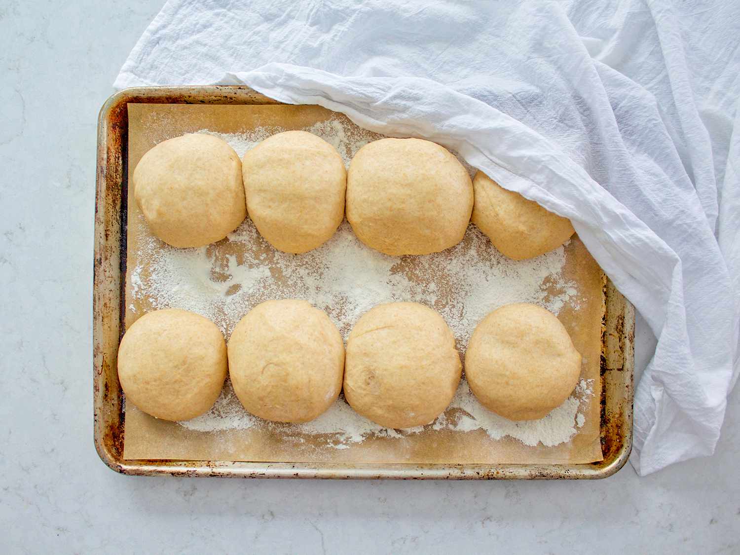 Balls of taboon dough resting.